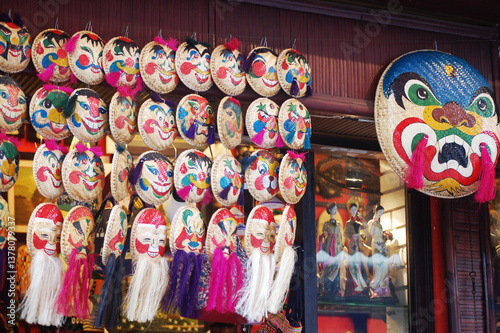 Vietnamese local souvenir gift shop bamboo wicker pannier basket traditional mask painting for sale travelers people in Ba Dinh Old Town Quarter Square at Hoan Kiem on July 7, 2012 in Hanoi, Vietnam