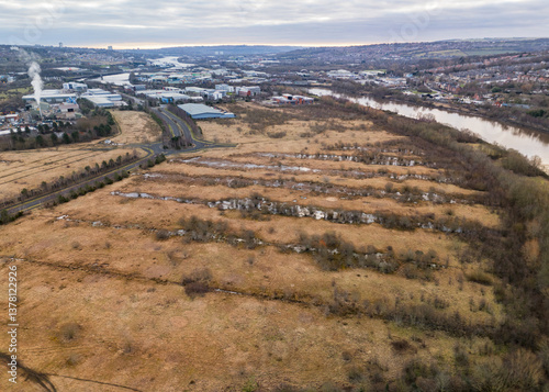 Obraz na płótnie Industrial park development with loads of empty land and flooded water logged fields w salonie