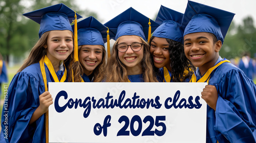 Congratulations class of 2025! Group of high school or college students holding sign celebrating graduation