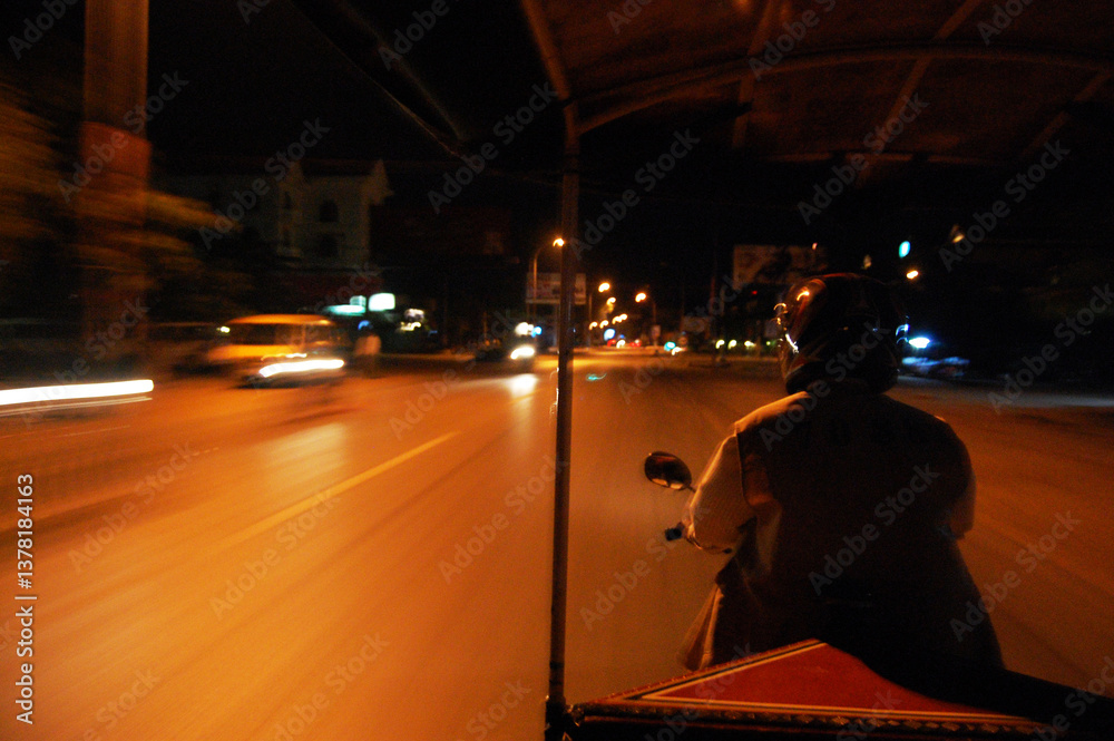 Naklejka premium Cambodia people riding motorcycle for service cambodian and foreign travelers send receive go to travel visit ancient ruins Khmer Empire of Angkor Wat city temple in morning at Siem Reap, Cambodia