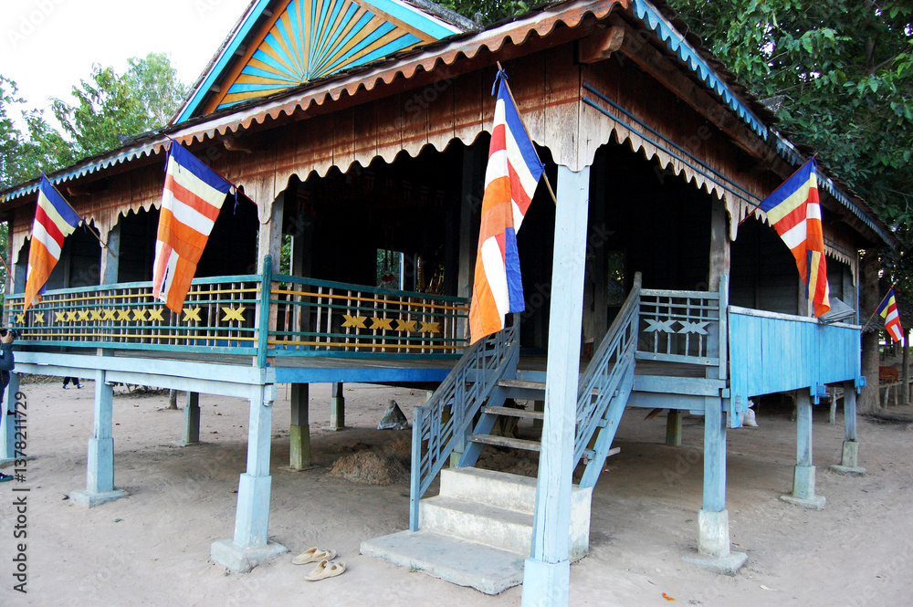 Fototapeta premium Wooden pavilion ubosot of ancient ruins Prasat West Mebon temple in reservoir West Baray or Baray Teuk Thla for Cambodian people and traveler travel visit at Angkor Thom Wat in Siem Reap, Cambodia