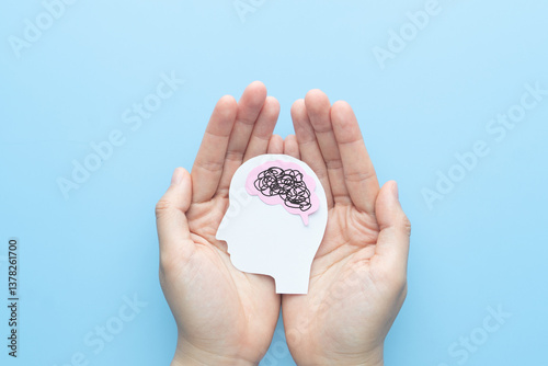 Human head with brain as tangled messy single line on blue background. Concept of mental disorder, ADHD symptom, finding solution, chaotic thinking process, confused mind. Mental health care.