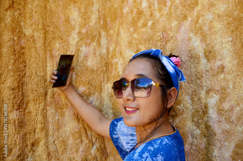 Thai women selfie by mobile phone at Phae Mueang Phi photo