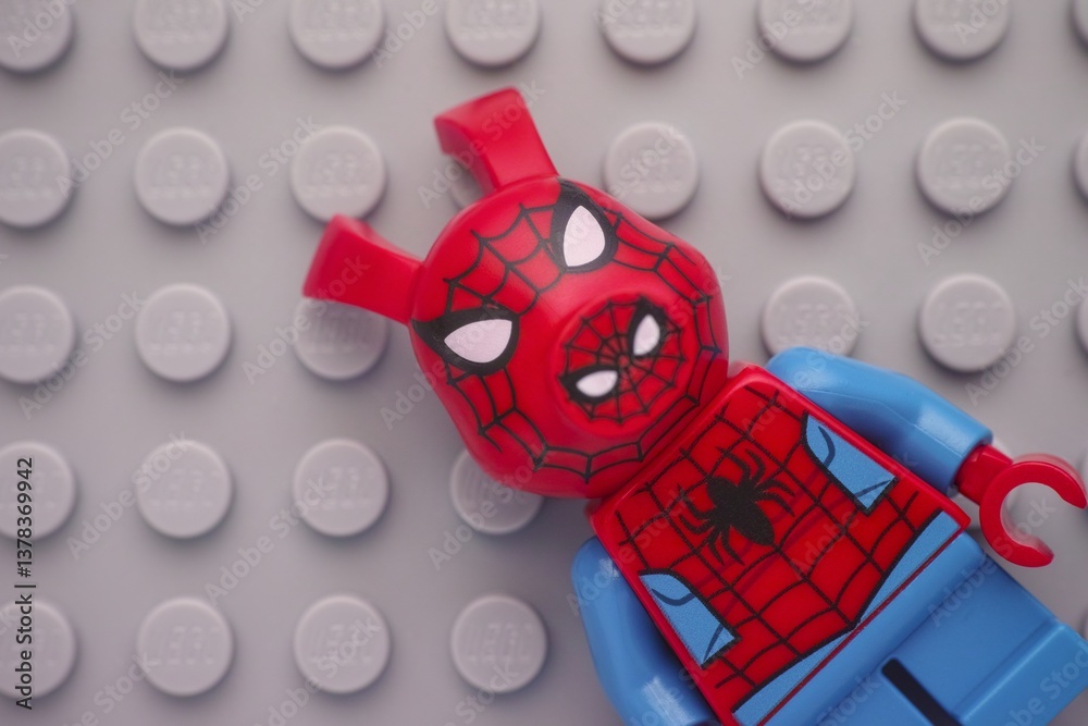 Naklejka premium Tambov, Russian Federation - January 24, 2025 Lego Spider-Ham minifigure on a gray baseplate background