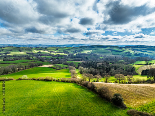 Obraz na płótnie Farms over Road A35 from a drone, Morcombelake Village, Bridport, Dorset, England w salonie