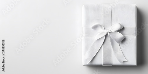 Elegant White Gift Box Wrapped with Ribbon on a Light Background