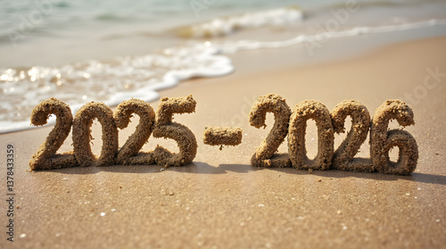 Against the background of waves on the sea coast of the year 2025-2026. Years 2025-2026 from sand on the ocean shore.