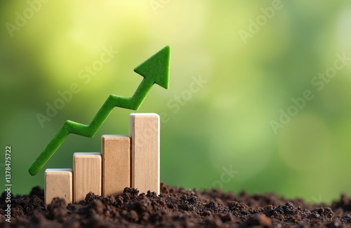 Obraz na płótnie Green upward arrow graph wooden blocks placed in soil with blurred green background. Concept of sales growth financial profit marketing investment. Symbol of profit, success, economic growth, w salonie