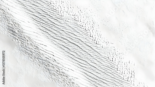 Aerial view of abstract white dunes and linear patterns in a desert landscape