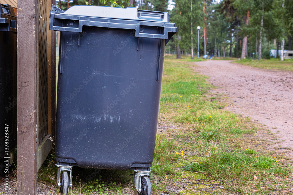 Garbage trash bin in a forest area. Waste management in mature Waste sorting management in an camping. Sustainable waste disposal system. Outdoor trash storage. Finland, Kymenlaakso, Hamina Garbage trash bin in a forest area. Waste management in mature Waste sorting management in an camping. Sustainable waste disposal system. Outdoor trash storage. Finland, Kymenlaakso, Hamina
