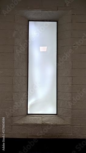 Elegant Vertical Window Design with Frosted Glass and Brick Wall Backdrop