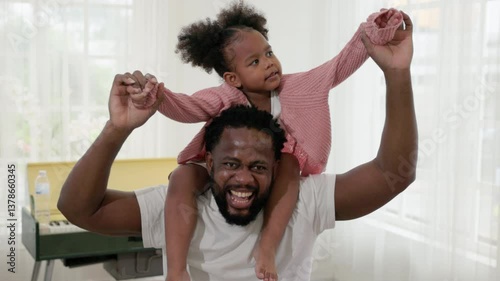 enjoy happy love black family african american father carrying daughter little african girl child smiling and having fun moments good time. American father day concept.