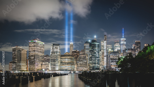 Night view from old pier during 9 11 of lower Manhattan with the Tribute in Light in the background