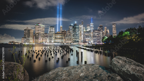 Night view from old pier during 9 11 of lower Manhattan with the Tribute in Light in the background