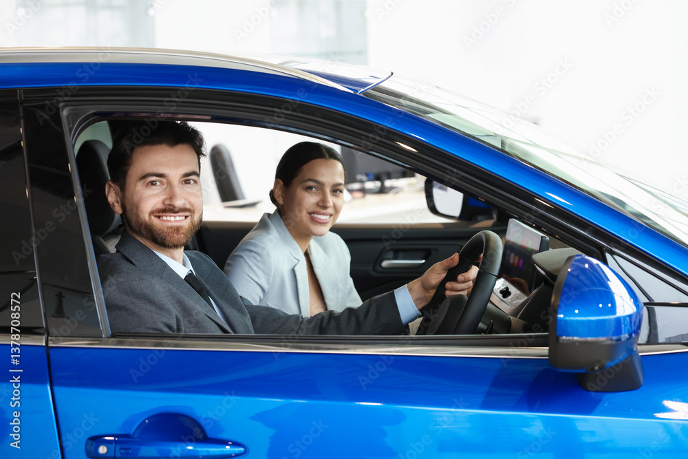 Happy saleswoman and client inside new car in salon