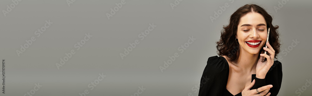 Confident young woman smiles with red lips and braces on a neutral background Confident young woman smiles with red lips and braces on a neutral background