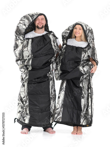 A man and a woman in sleeping bags. Isolated on white background
