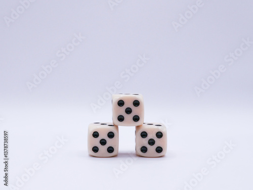 Three dice arranged in a pyramid, with a value of five, on a white background, front view, game, success, casino