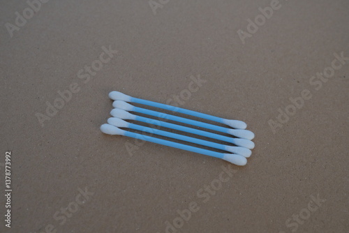 Several light-blue tipped cotton swabs