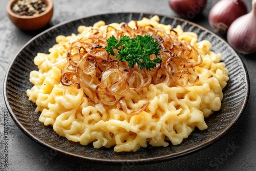 A rustic plate of kÃ¤sespÃ¤tzle with caramelized onions and melted cheese, isolated on a transparent background. photo