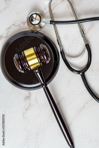 A judge's gavel and a physician's stethoscope. access and entitlement to health care regardless of race, religion, ethnicity, socioeconomic status
