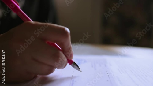 Woman signing document note close up. Selective focus.