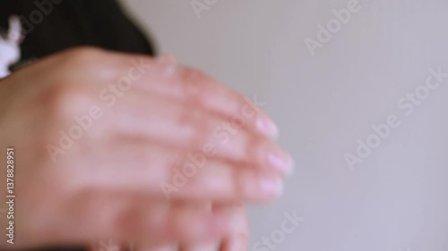 Woman applying moisturizing cream product on hands close up. Selective focus.