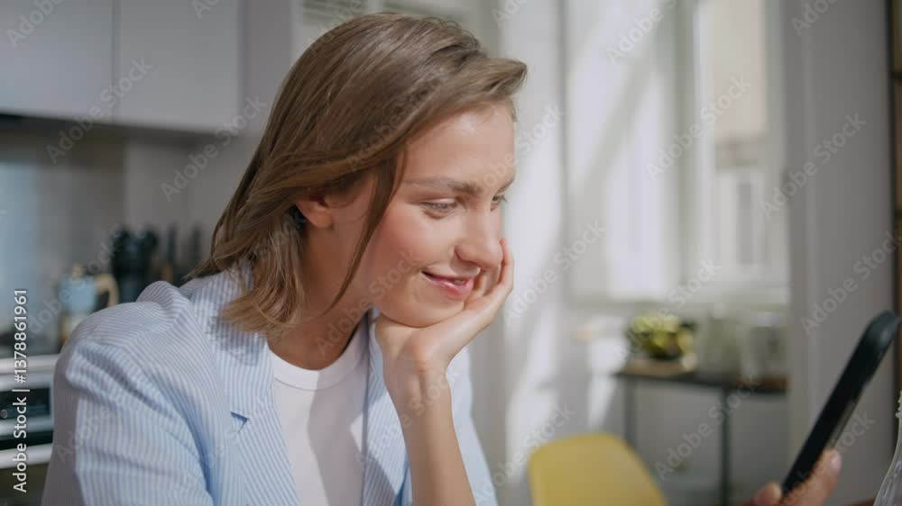 Surprised girl looking mobile phone at home closeup. Happy woman reading news