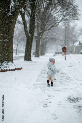 little girl running in the  snow