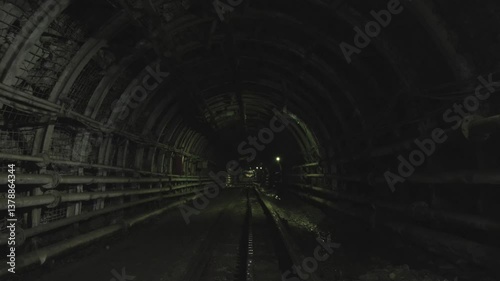 The wagon moving forward in coal mine.