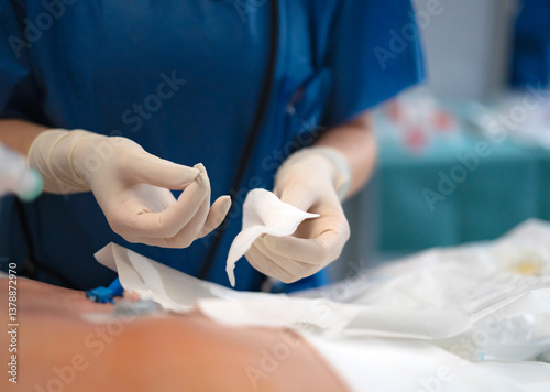 Papier peint Surgeon preparing gauze for wound dressing during surgery