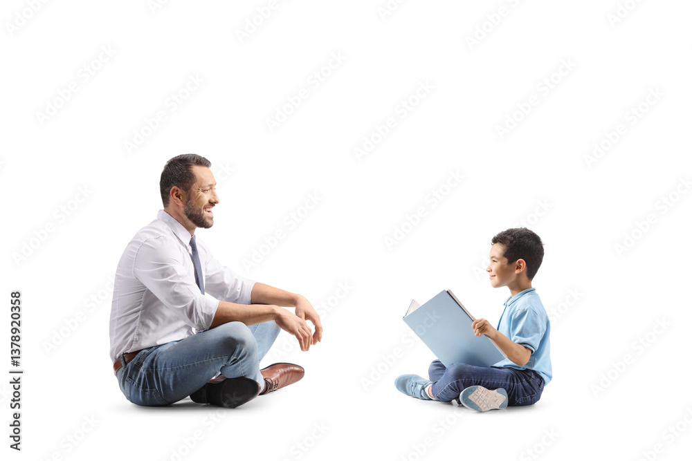 Little boy reading a story to a man, family fun concept Little boy reading a story to a man, family fun concept