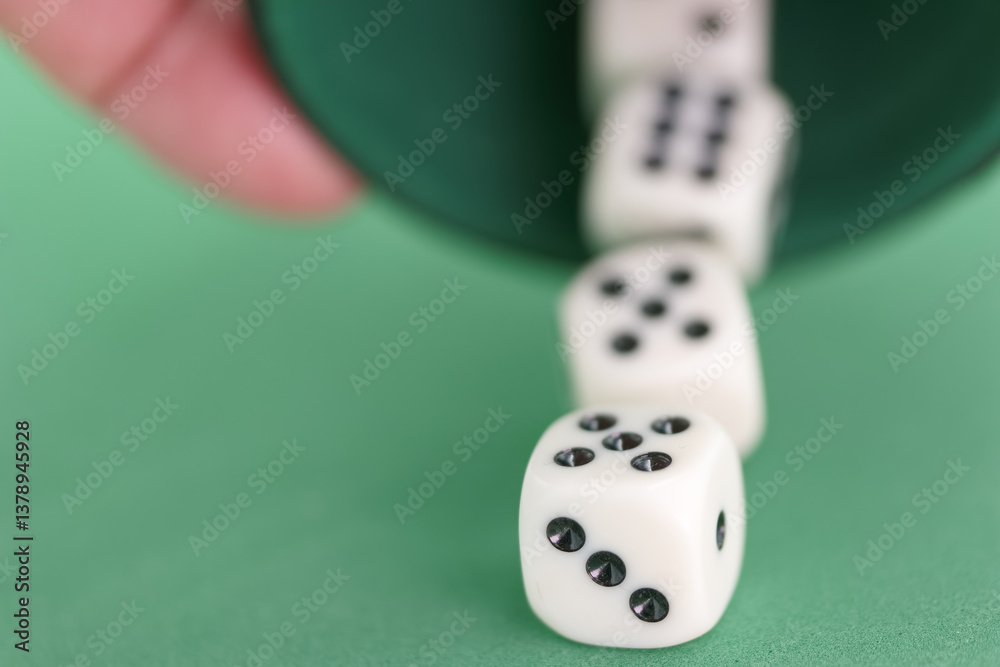 Excitement builds as dice tumble from a cup during a game in a c