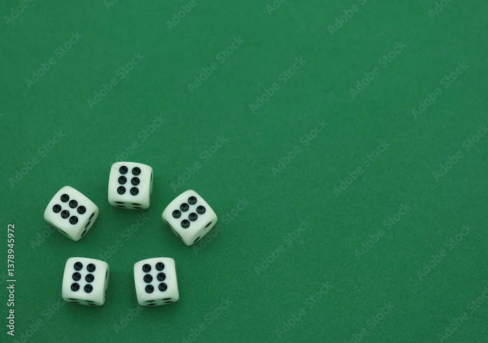 Five white dice arranged on a green surface showing various numb