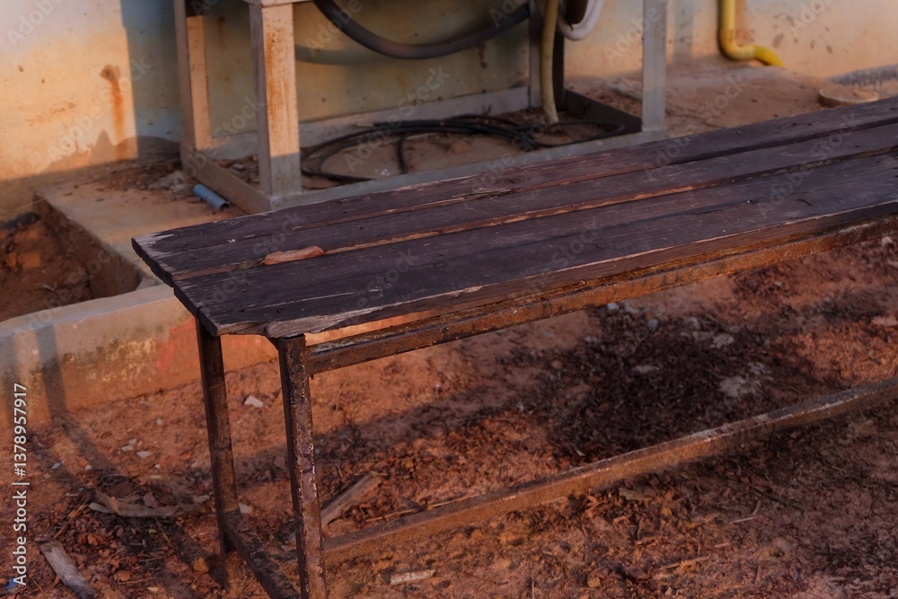 Rustic Wooden Bench in Outdoor Setting with Soft Evening Light Rustic Wooden Bench in Outdoor Setting with Soft Evening Light