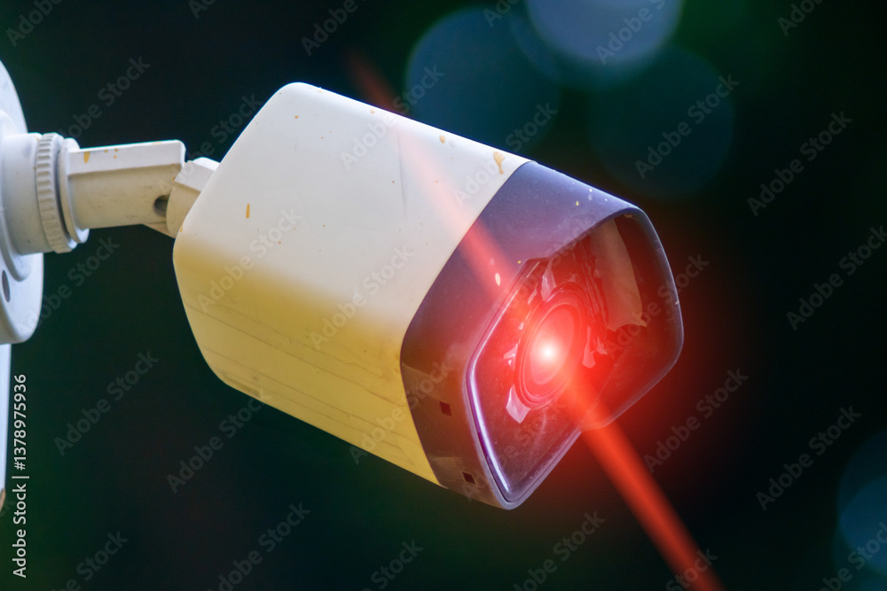 Security Camera with Red Light on a Blurred Background