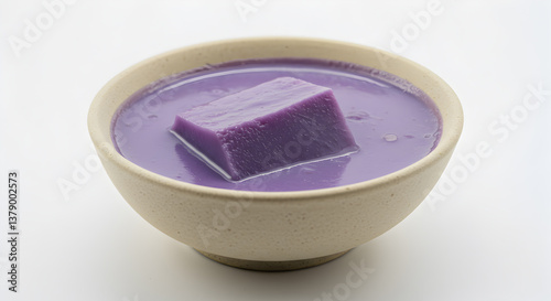Appealing presentation of a Thai sweet purple yam custard dessert in bowl