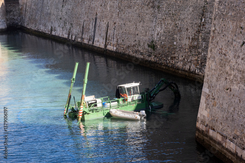 Dredging work in the Ceuta navigable moat in Spain.