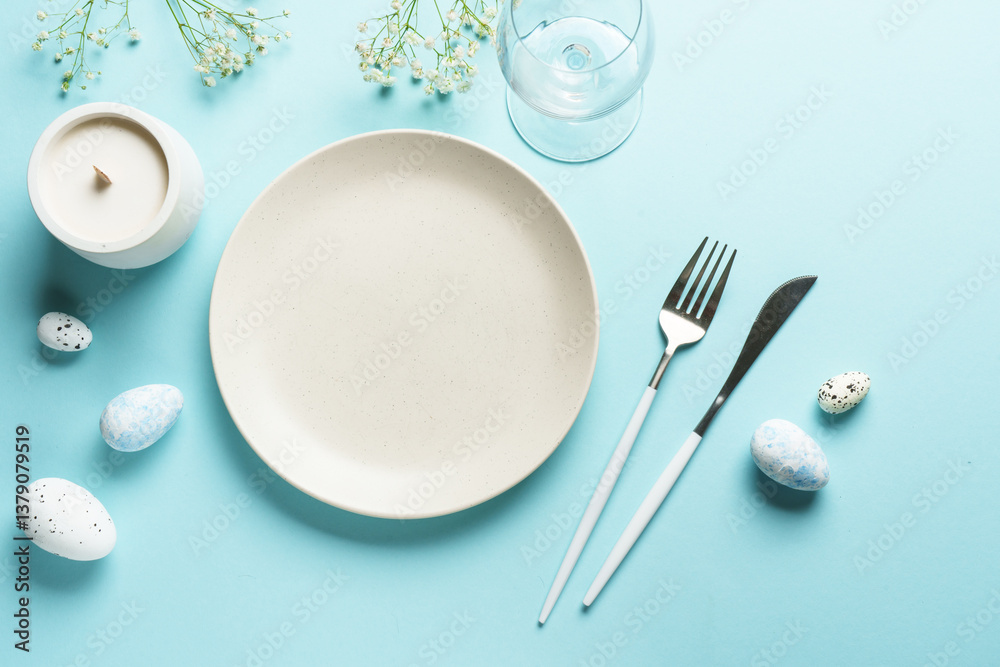 Easter table setting on blue.