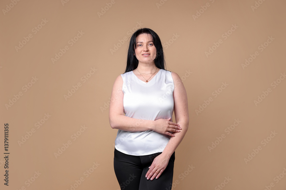 Portrait of smiling plus size model on beige background. Overweight Portrait of smiling plus size model on beige background. Overweight