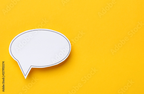 Obraz na płótnie Blank speech bubble on yellow background, top view. Space for text w salonie