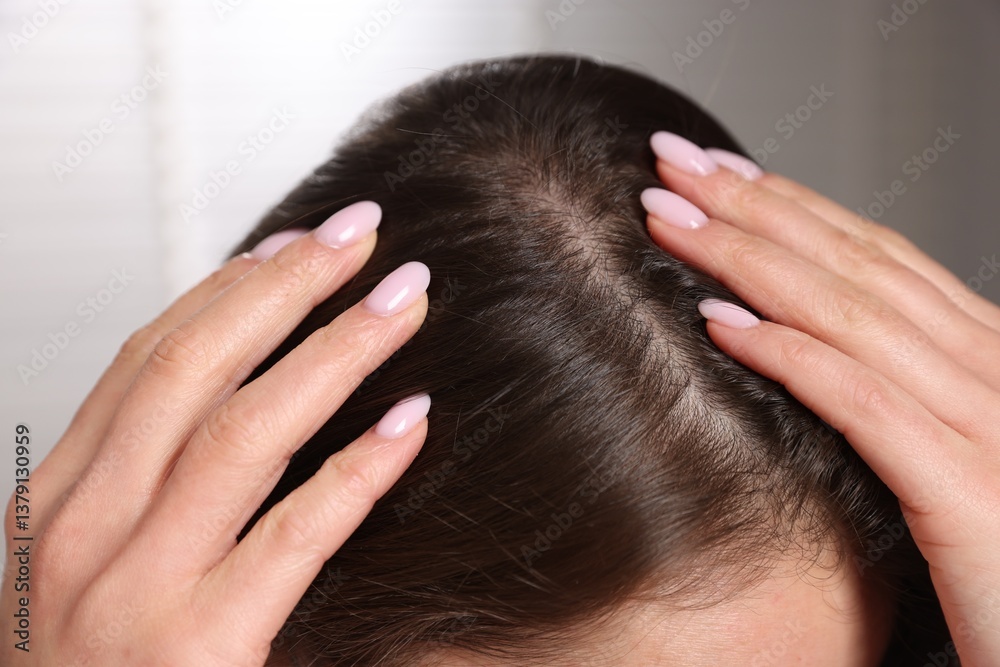 Fototapeta premium Woman with healthy hair roots on blurred background, closeup