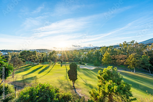 Tableau sur toile a sunset landscape image overlooking a mediterranean golf course in Spain