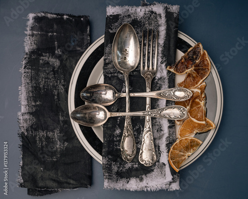 Vintage cutlery fork spoon knife. Retro silverware set. Metal flatware with patina and rust 