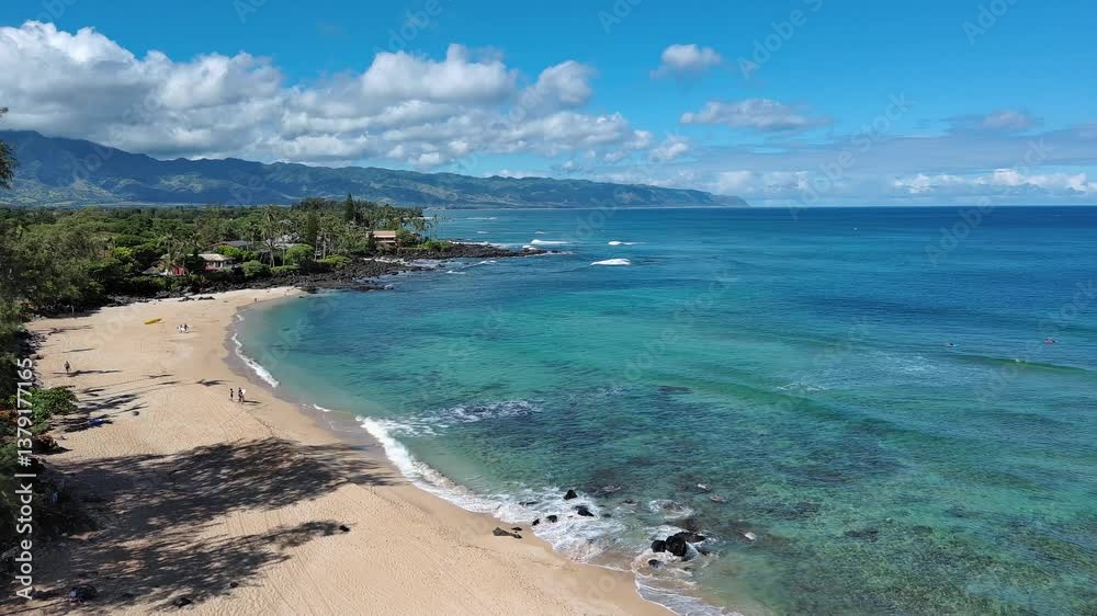 Aerial view of Chun's reef small wave surfing on North Shore of Oahu, Hawaii Aerial view of Chun's reef small wave surfing on North Shore of Oahu, Hawaii