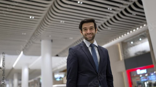 Wallpaper Mural Business man looking at camera while standing at white background. Closeup of successful man smiling at camera while wearing business suit. Executive manager look at camera. Moving camera. Exultant. Torontodigital.ca