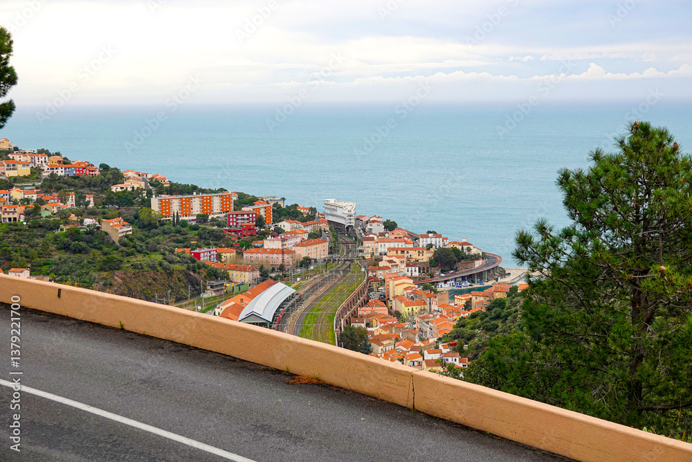 This captivating landscape showcases a coastal town overlooking the Mediterranean Sea. Cerbere, France.