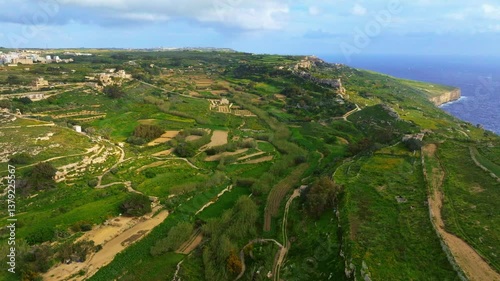 Drone day view of green hills and fields, sea. Nature landscape of  Maltese