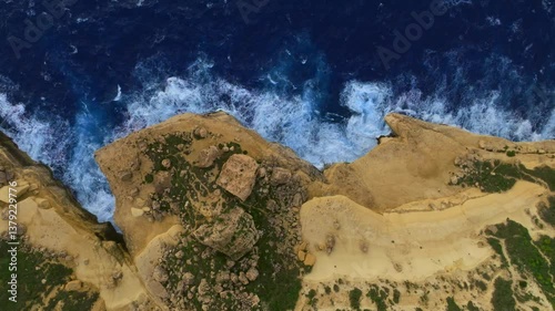 Drone top view of rocks and waves. Mediterranean sea