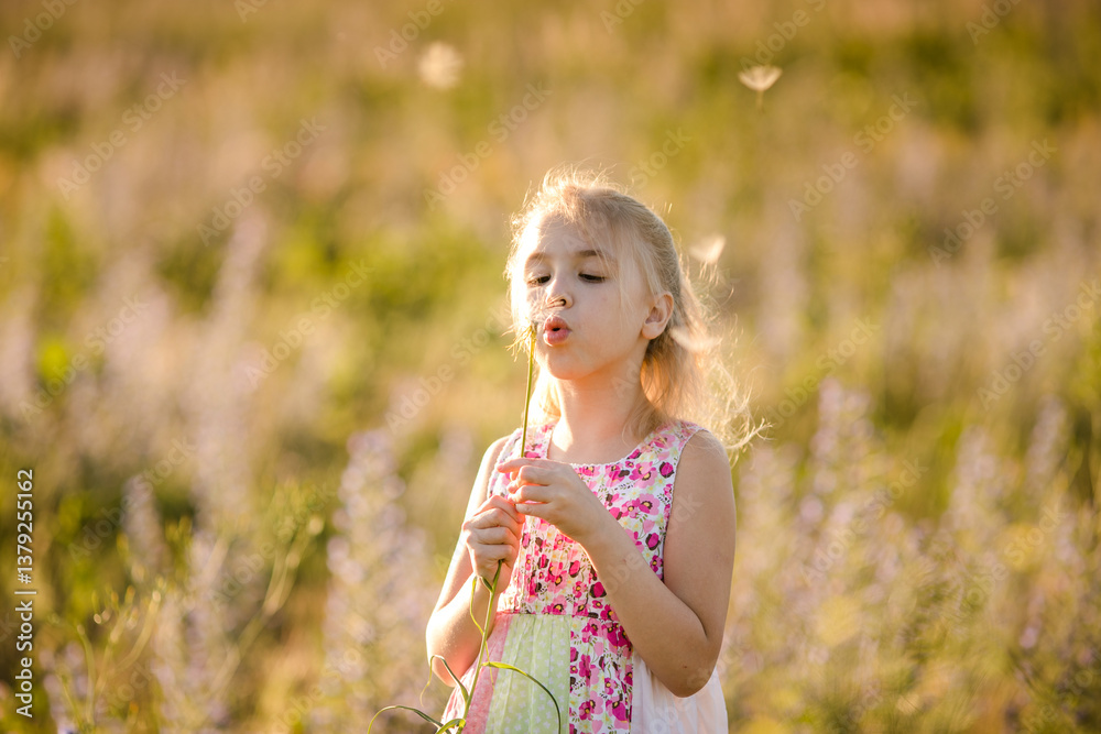 Girl Blowing Dandelion Seeds in Summer Field Girl Blowing Dandelion Seeds in Summer Field